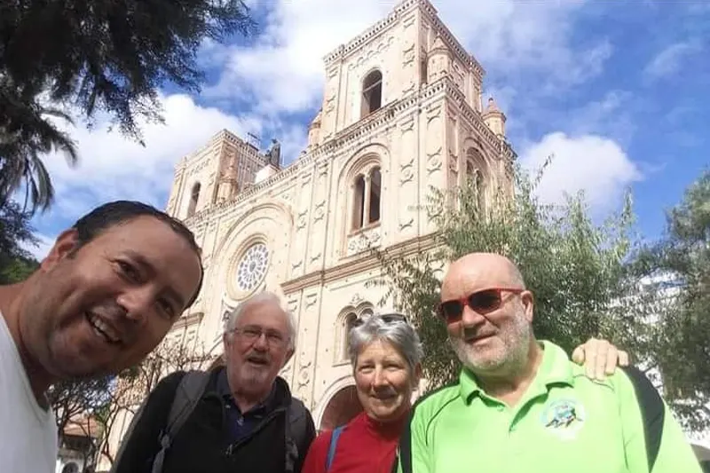 Marco Herrera with travelers in front of the New Cathedral of Cuenca, Ecuador