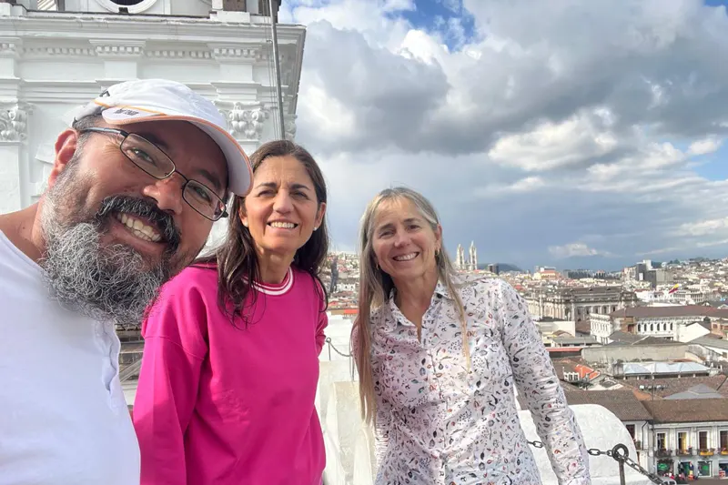 Marco Herrera with travelers on the towers of San Francisco Church in Quito, Ecuador
