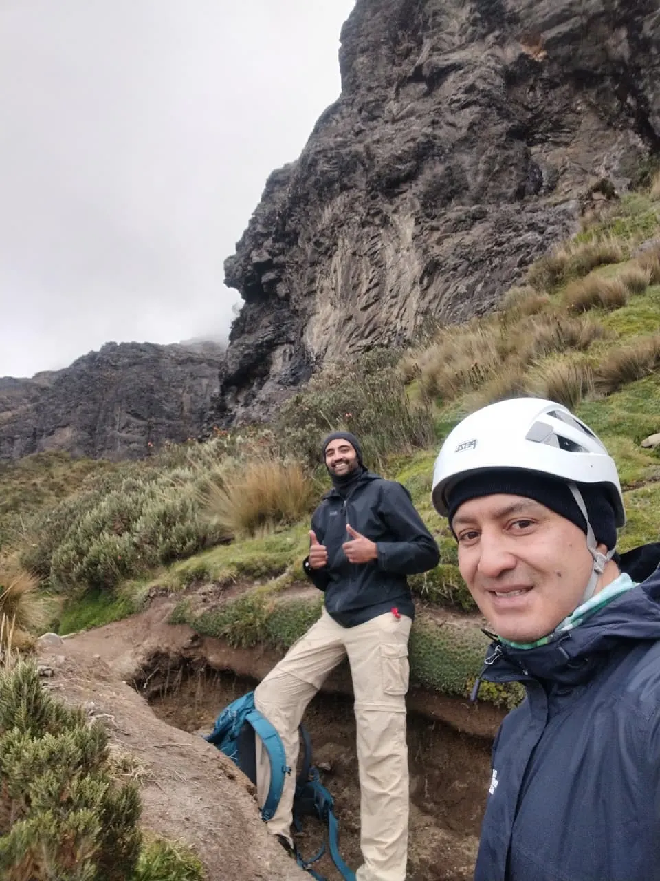 Local hiking guide leading travelers through a high-Andean trail near Quito
