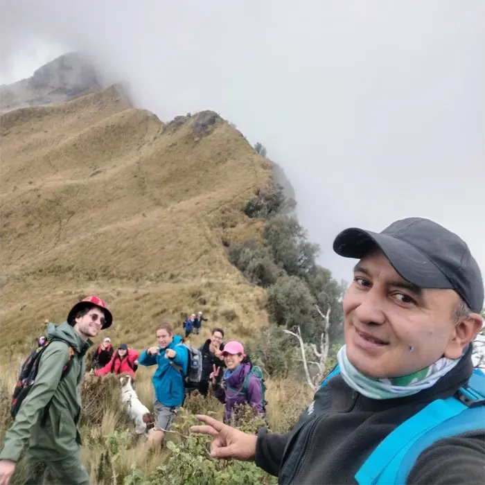 Private hiking group taking a break on an Andean trail in Ecuador